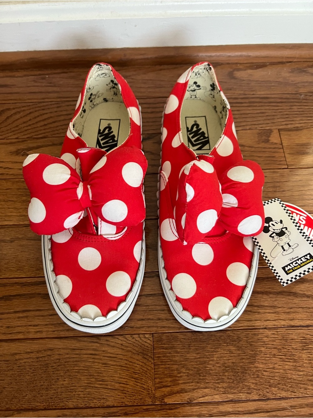 Vans x Disney Red and White Polka Dot Slip-On Sneakers with Bow Accent